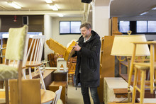 Sweden, Man Choosing Furniture In Store