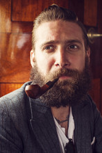 Close Up Of Bearded Man With Smoking Pipe