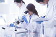 © Monet - Researchers are analyzing a microscope
