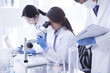 © Monet - Researchers are analyzing a microscope