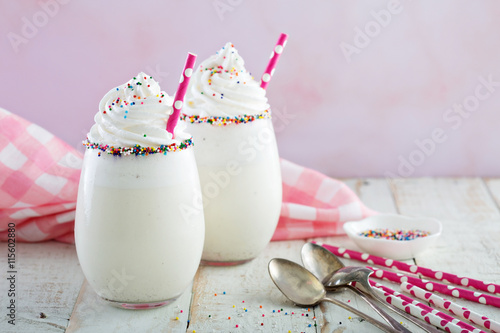 Fotografie, Obraz Vanilla milkshake with whipped cream and sprinkles