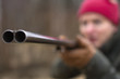 © FOLIO - Close up of hunter holding shotgun