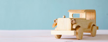 Vintage Wooden Toy Car Over Wooden Table