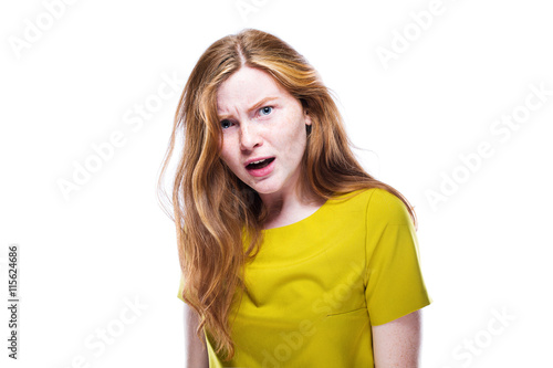 Fotografia, Obraz Portrait of interrogative and serious young girl isolated on whi