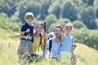 Portrait of happy family on a hiking day in the mountain