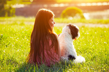 cute redhead girl with dog. friendship concept