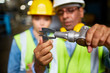 © pressmaster - Measuring metallic part