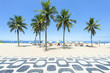 Classic empty view of the Ipanema Beach boardwalk with palm trees and blue sky and no people in Rio de Janeiro, Brazil