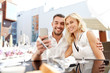 © Syda Productions - couple taking selfie with smatphone at restaurant