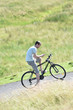 © goodluz - Man sitting on his bike using smartphone