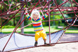 © famveldman - Little boy on a playground