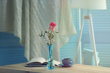 Wall Mural - Beautiful rose on wooden table