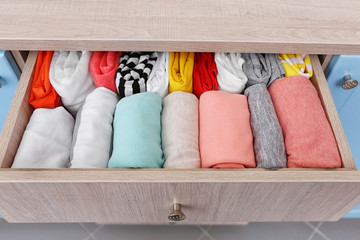 Wall Mural - Neatly folded clothes in chest of drawers