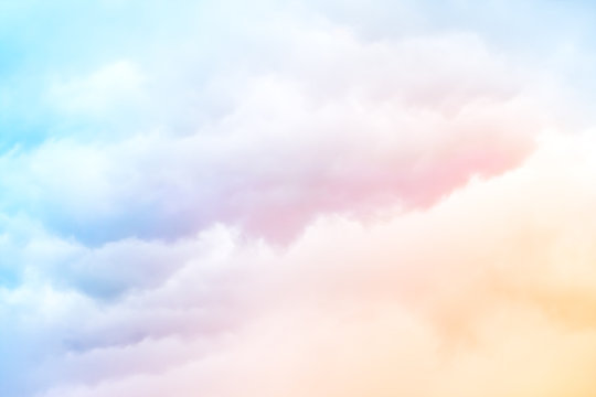 Fototapete - Rainbow Clouds.  A soft cloud background with a pastel colored orange to blue gradient.