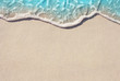 Leinwanddruck Bild - Soft ocean wave on the sandy beach, background.