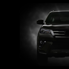SUV Car On Black Background With Smoke Effect