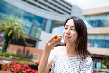 Sticker - Woman enjoy egg tart at outdoor