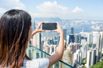 Canvas Print - Woman taking photo of Hong Kong city