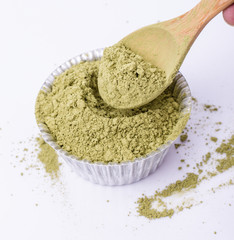 greentea powder. greentea powder on bakery cup  isolated on whit