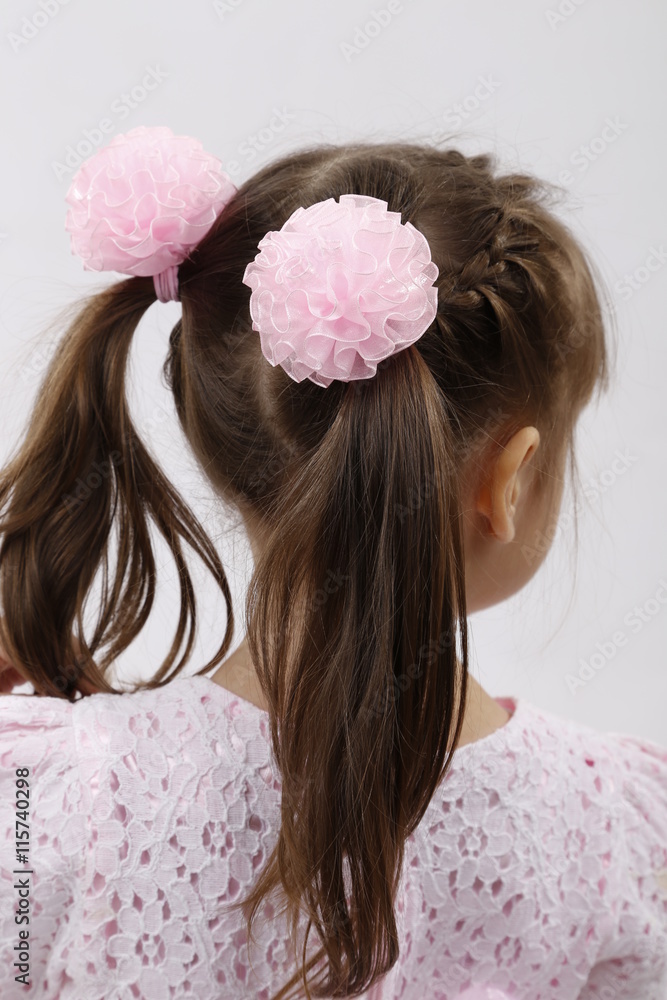 Back view of a little girl hairstyle with pink bow-knots Stock Photo ...