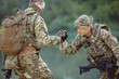 © kaninstudio - rangers during the military operation. soldiers climbing on mountain