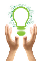 Hands holding green ecology light bulb