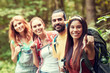 © Syda Productions - group of smiling friends with backpacks hiking