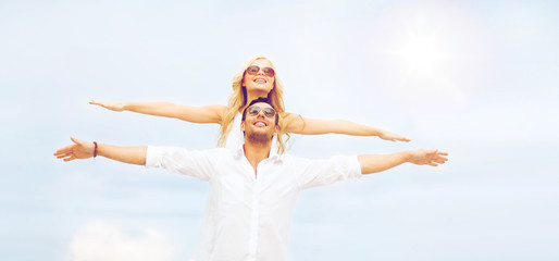 Poster - couple holding hands up at sea side