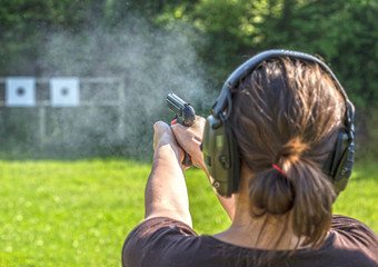 Girl shooting with a gun