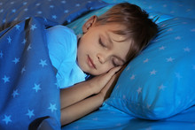 Adorable Little Boy Sleeping In Bed