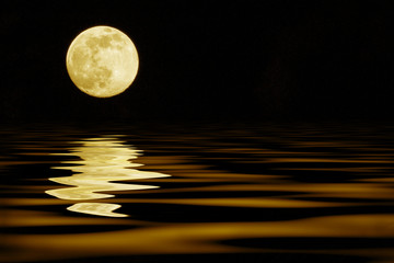 yellow moon over sea