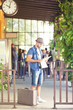 © bokan - Young and happy man reading newspapers