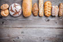 Delicious Fresh Bread On Wooden Background