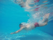 © vladstar - Beard man with glasses diving in a pool