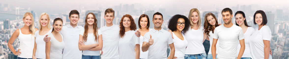 Wall Mural - group of happy different people in white t-shirts