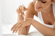© puhhha - Woman Hand Cream. Close Up Of Beautiful Girl Applying Lotion