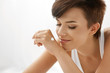 © puhhha - Skin Care. Beautiful Happy Woman With Hand Cream Lotion On Hands