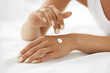 © puhhha - Woman Hands With Cream. Closeup Of Female Hands Applying Lotion