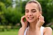 © Viacheslav Yakobchuk - Delighted smiling woman listening to music