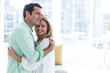 © WavebreakMediaMicro - Romantic couple hugging at home