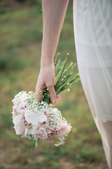 Wall Mural - Bride holding wedding bouquet 