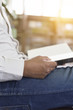 © 88studio - man reading book in aisle in library
