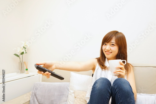 Young Japanese Woman Holding A Remote Controler Of Tv テレビのリモコンを持ちチャンネルを変える若い日本人の女性 Stock Photo Adobe Stock Young Japanese Woman Holding A Remote Controler Of Tv テレビのリモコンを持ちチャンネルを変える若い日本人の女性 Stock Photo Adobe Stock