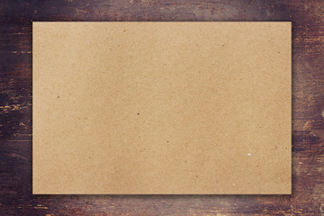 Wall Mural - brown paper on wood background with space