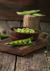 Wall Mural - Ripe green peas and pods