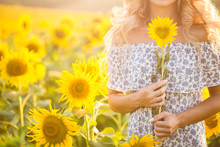 Portrait Of The Beautiful Girl With A Sunflowers