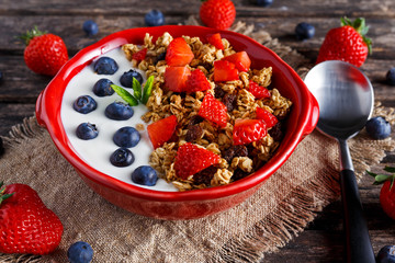 Wall Mural - Homemade granola Breakfast with yogurt and fresh fruit berries. concepts health food