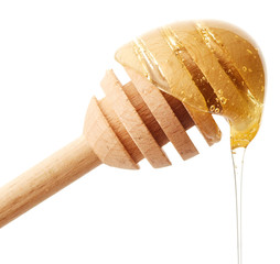 Canvas Print - Honey dripping from wooden honey dipper