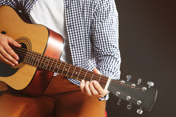 Wall Mural - Man playing acoustic guitar