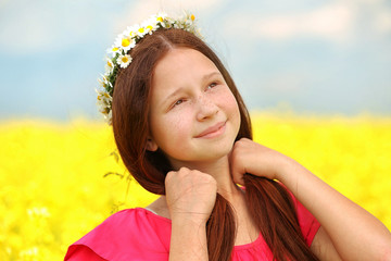 Wall Mural - Sweet girl in meadow with wild spring flowers